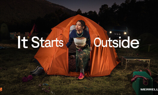 A woman stepping out of her tent