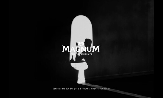 The silhouette of a Magnum ice cream bar overlayed by a person's shadow, with the text "MAGNUM, true to pleasure" laid overtop of the shot