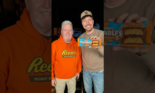 Brad Reese wearing a Reese's Peanut Butter Cups hoodie with MrBeast holding a Feastables Peanut butter Cup