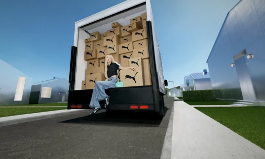 Rosé sitting on a truck full of PUMA boxes