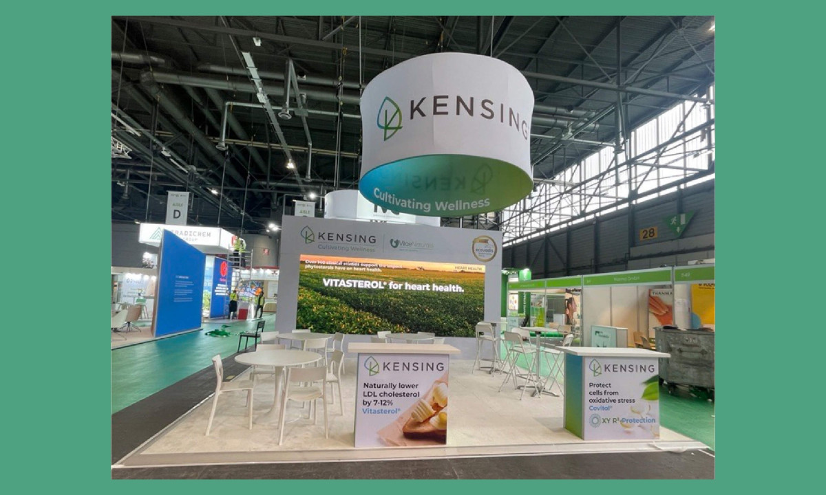 Booth extends brand identity into physical space with clear messaging and signage