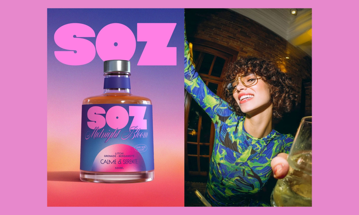 SOZ Midnight Bloom bottle with large pink logo beside a woman holding a drink in a nightlife setting
