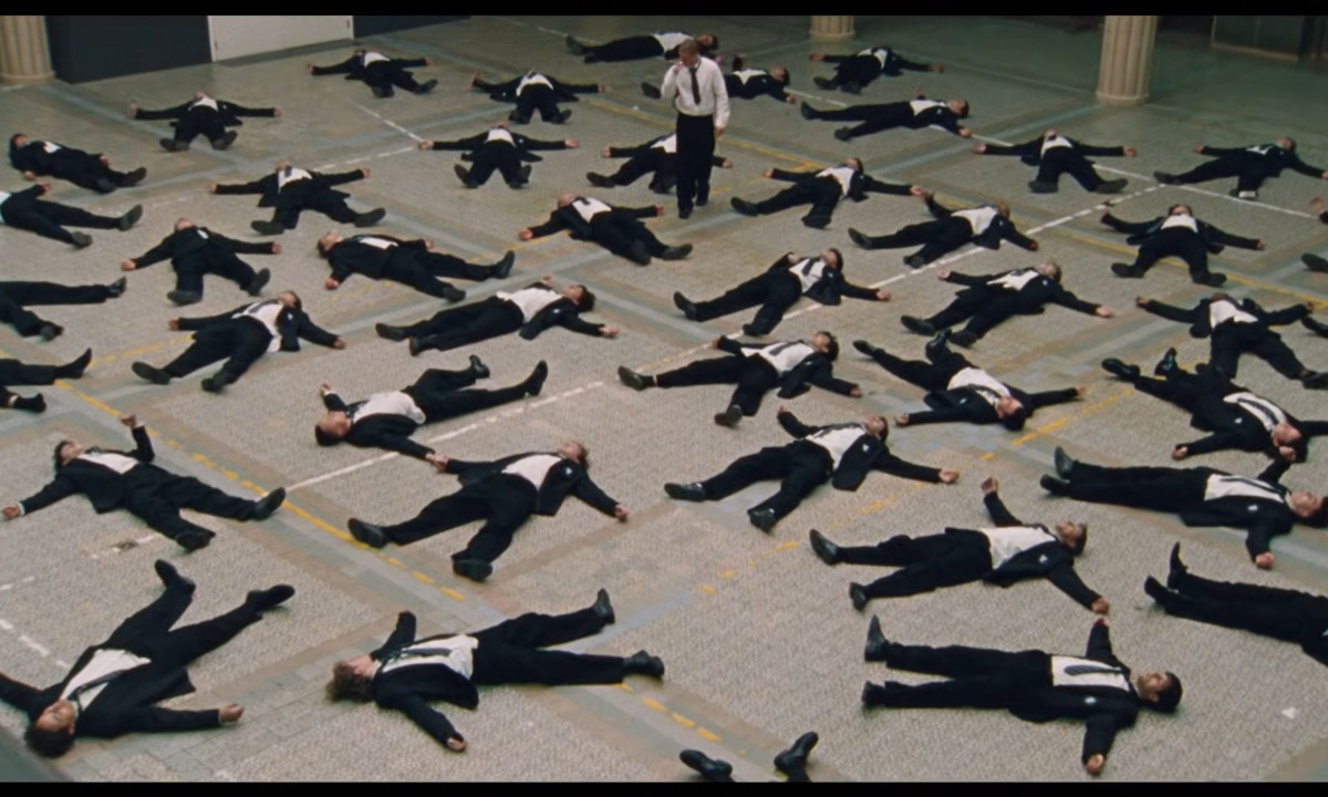 Aerial view of many students lying down on a courtyard floor