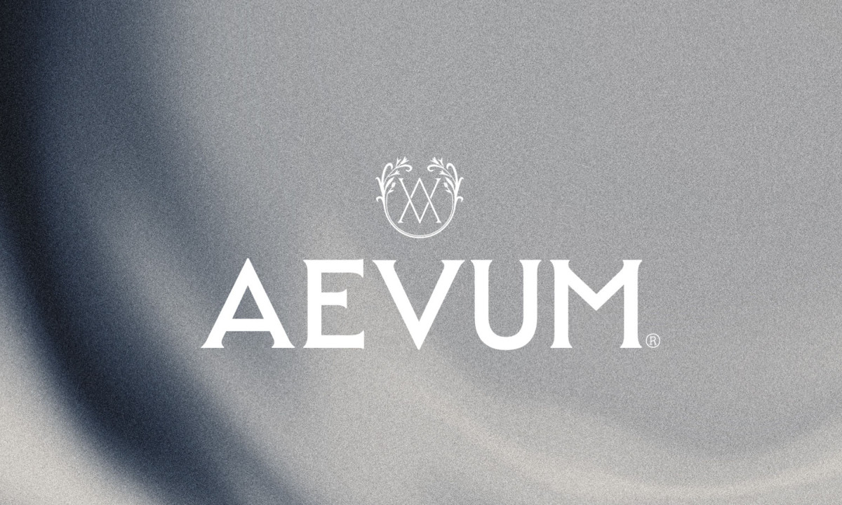 Close-up of an intricate circular monogram logo printed on paper