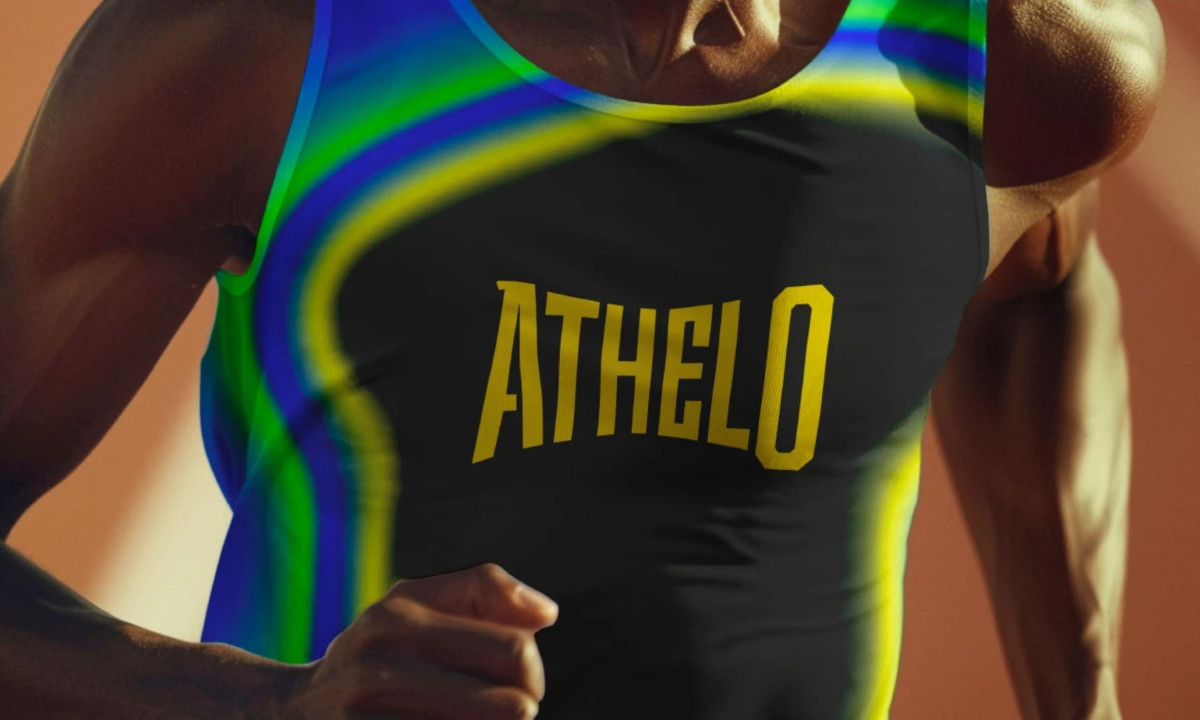 Runner wears vibrant jersey displaying striking yellow brand typography.