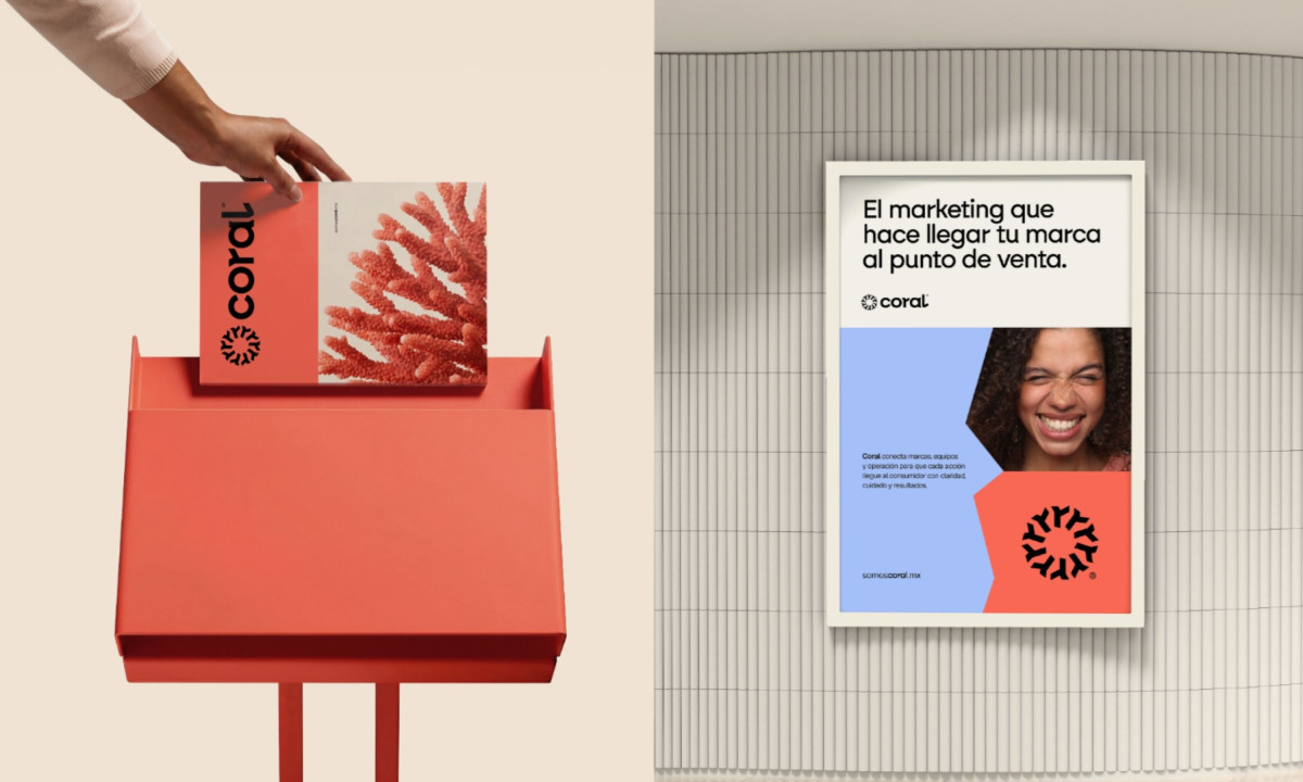 Hand places brochure beside a framed promotional poster.