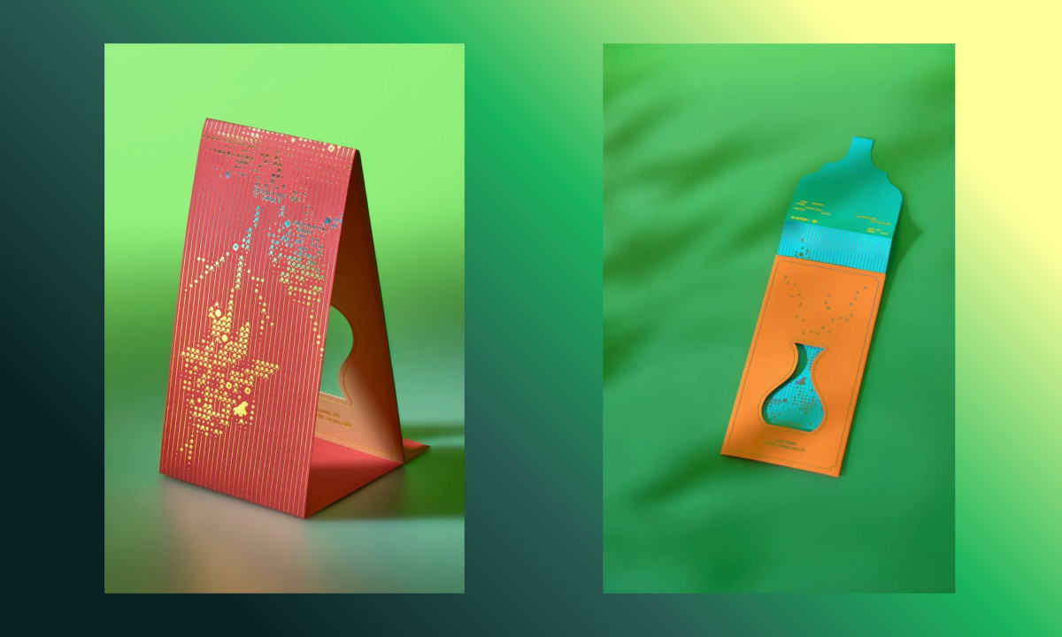 Red card and orange envelope display intricate cutouts
