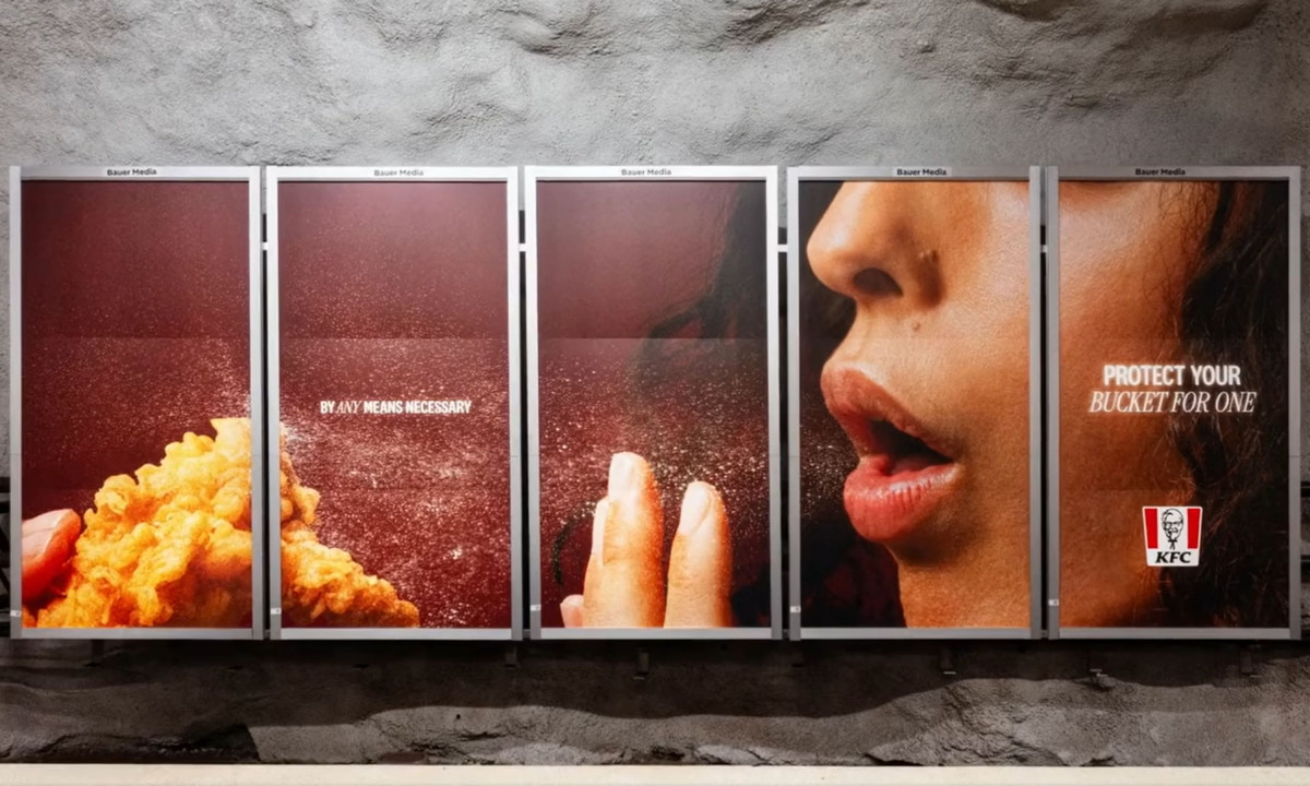 A five-panel billboard shows an extreme close-up of a person coughing over fried chicken with the text "Protect your bucket for one."