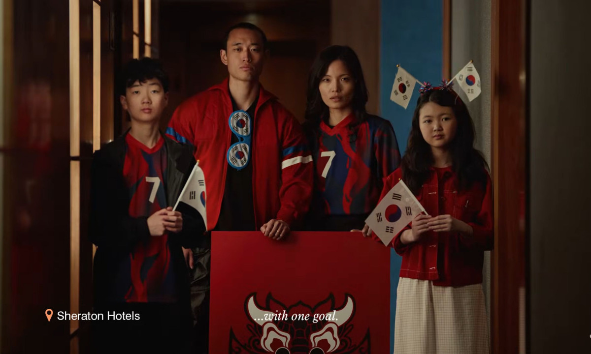 Video frame shows a family holding South Korean flags.