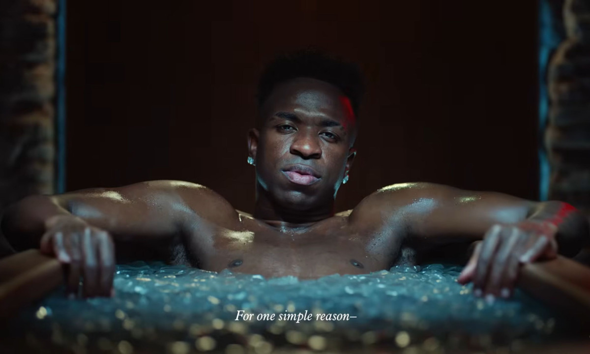 Video frame displays a man resting in ice water.