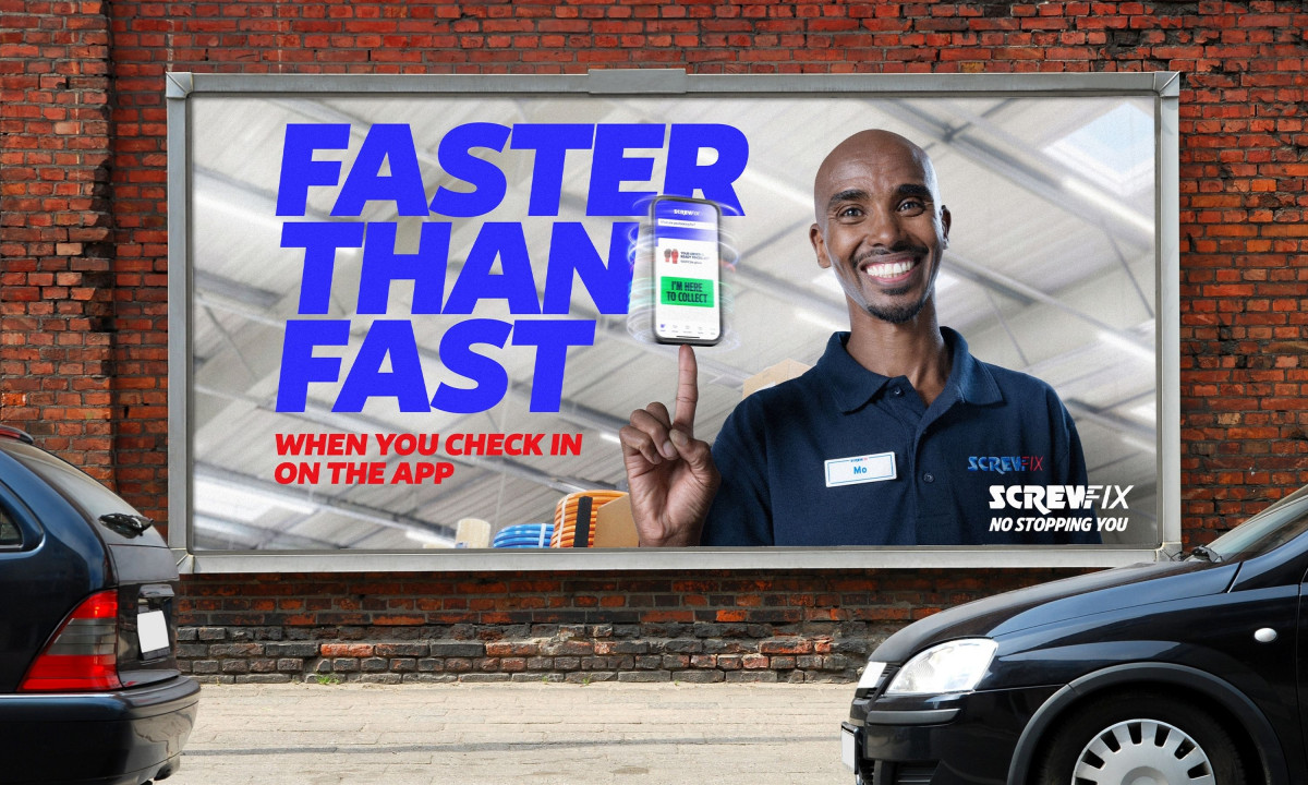 Billboard features a smiling worker balancing a smartphone.