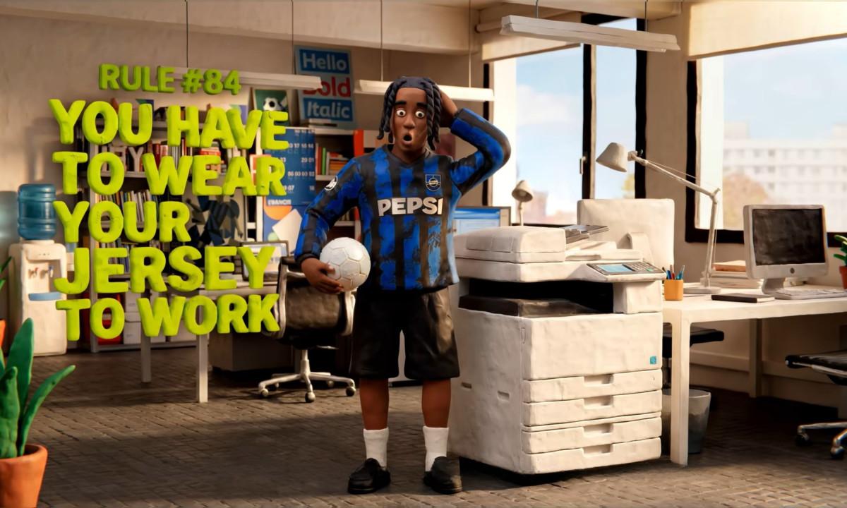 Claymation office worker wears a blue striped soccer jersey.