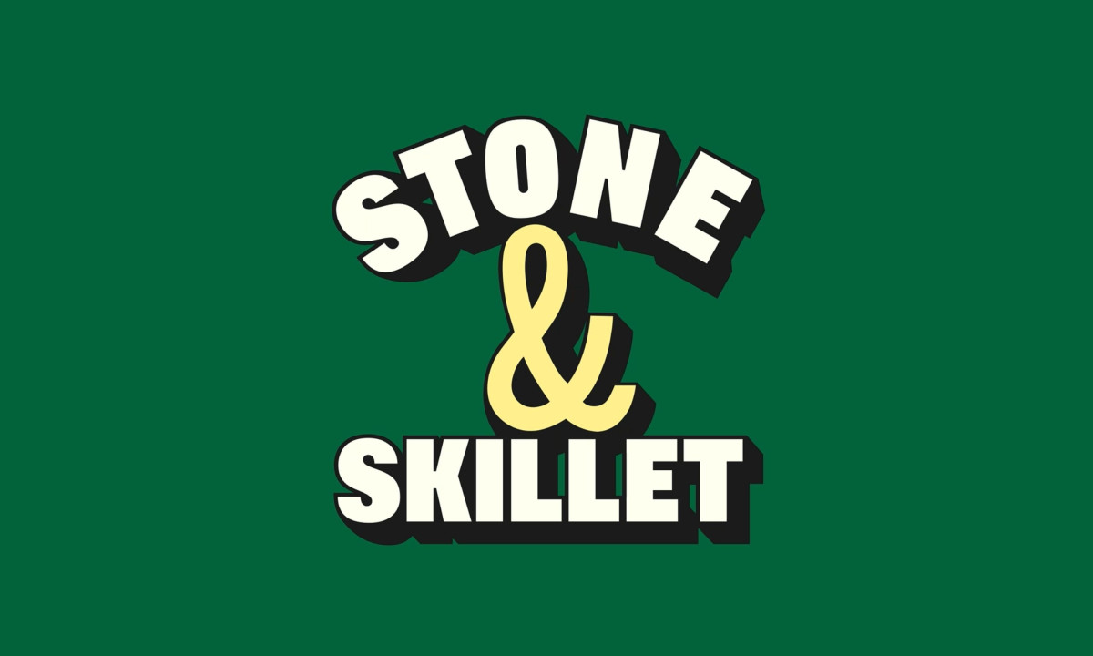 Stone & Skillet logo with thick, rounded cream lettering and a yellow ampersand on a deep green background.