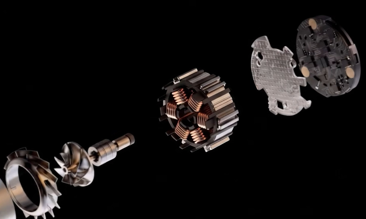 Segmented view of a metallic motor against a black background.