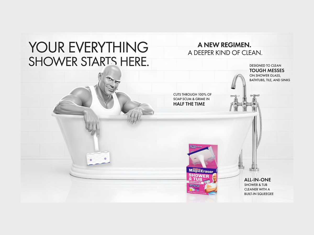 Mr. Clean in bathtub holding a scrubber product.