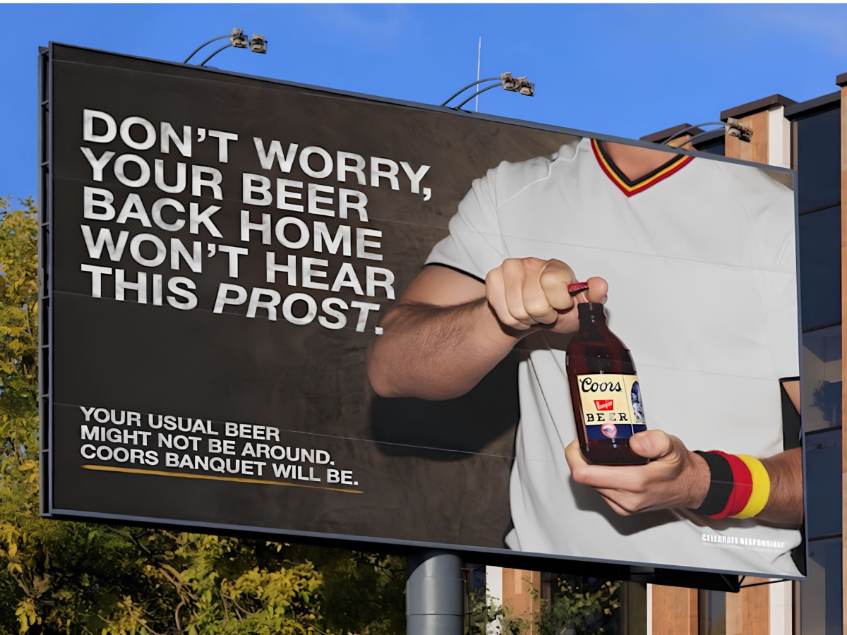 Coors billboard showing a fan opening a beer