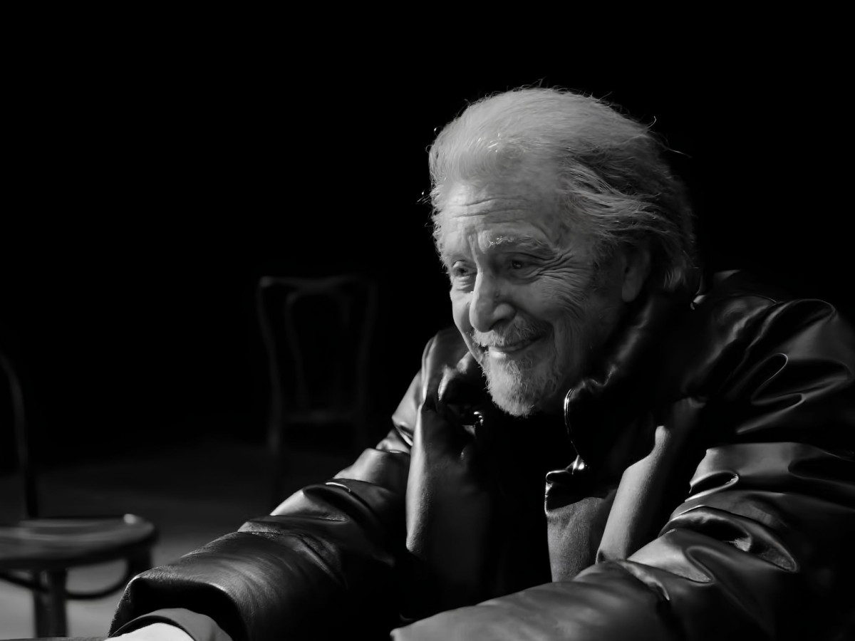 Al Pacino smiling in a Moncler jacket.