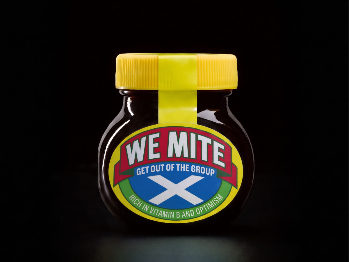 A WeMite jar featuring the Scottish flag and the slogan "Get out of the group" on a black background.