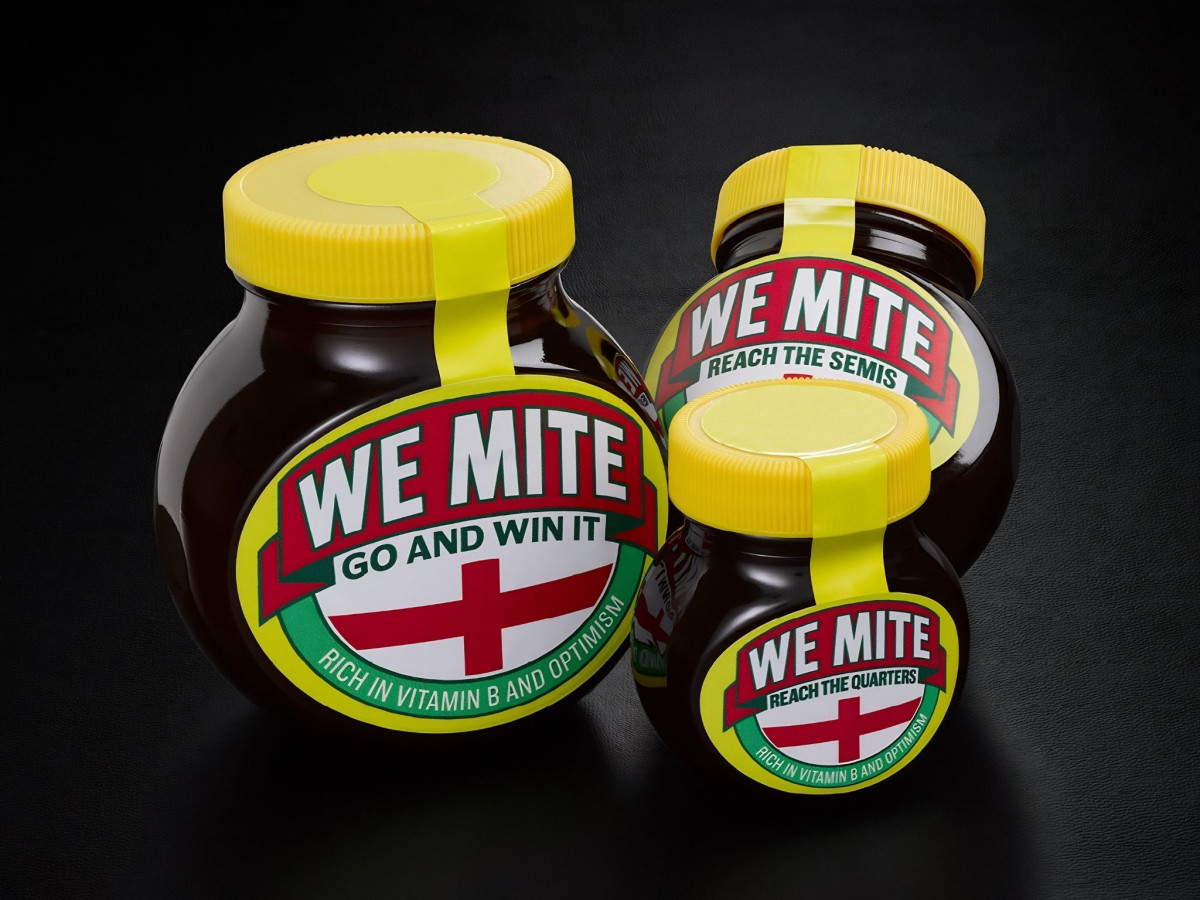 Three WeMite jars featuring the England flag and optimistic football slogans on a black background.