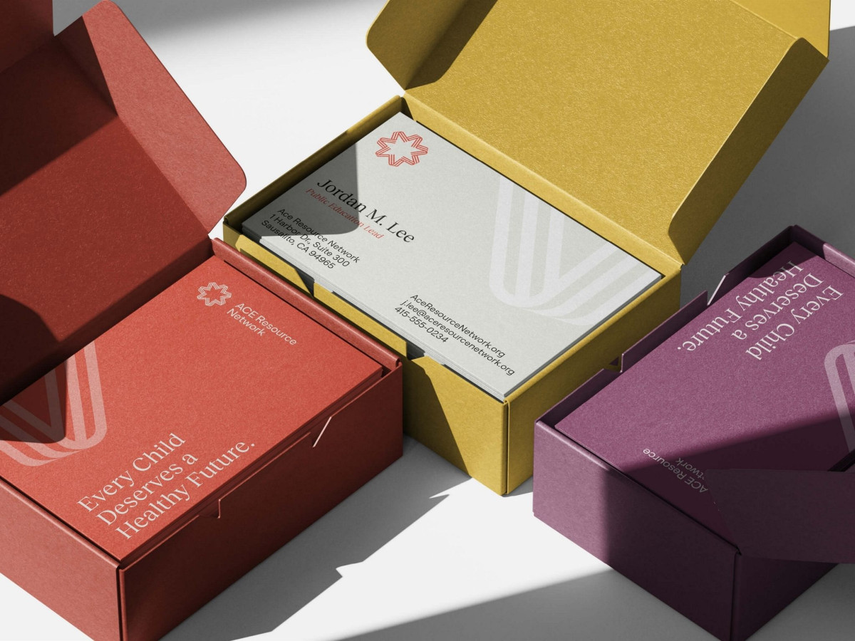 Three colorful boxes holding ACE Resource Network business cards.