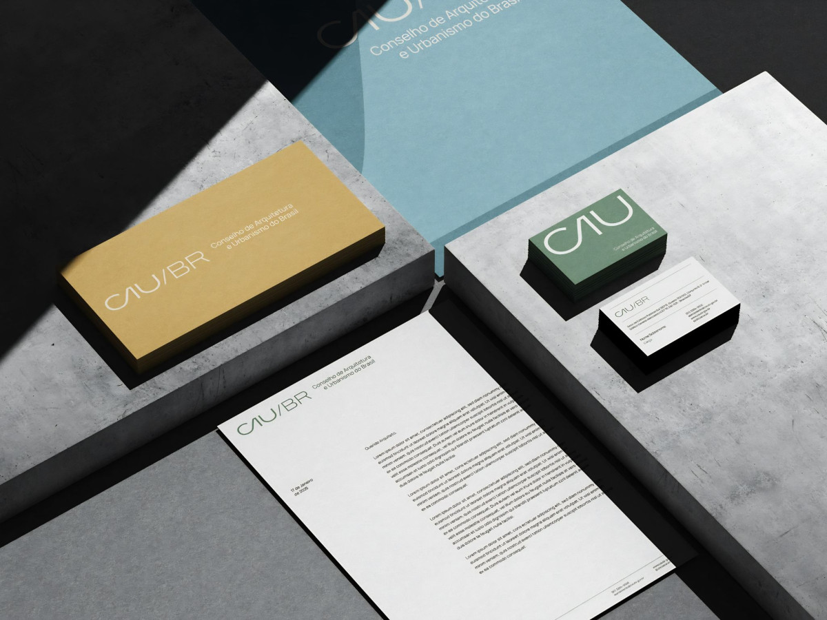CAU/BR stationery mockup on concrete blocks.