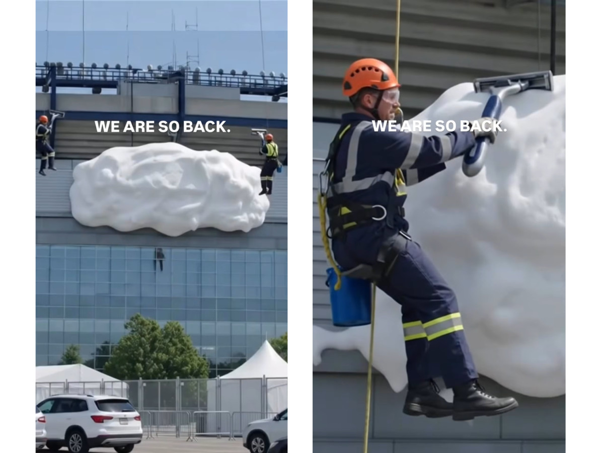 Suspended worker using a giant razor on foam.