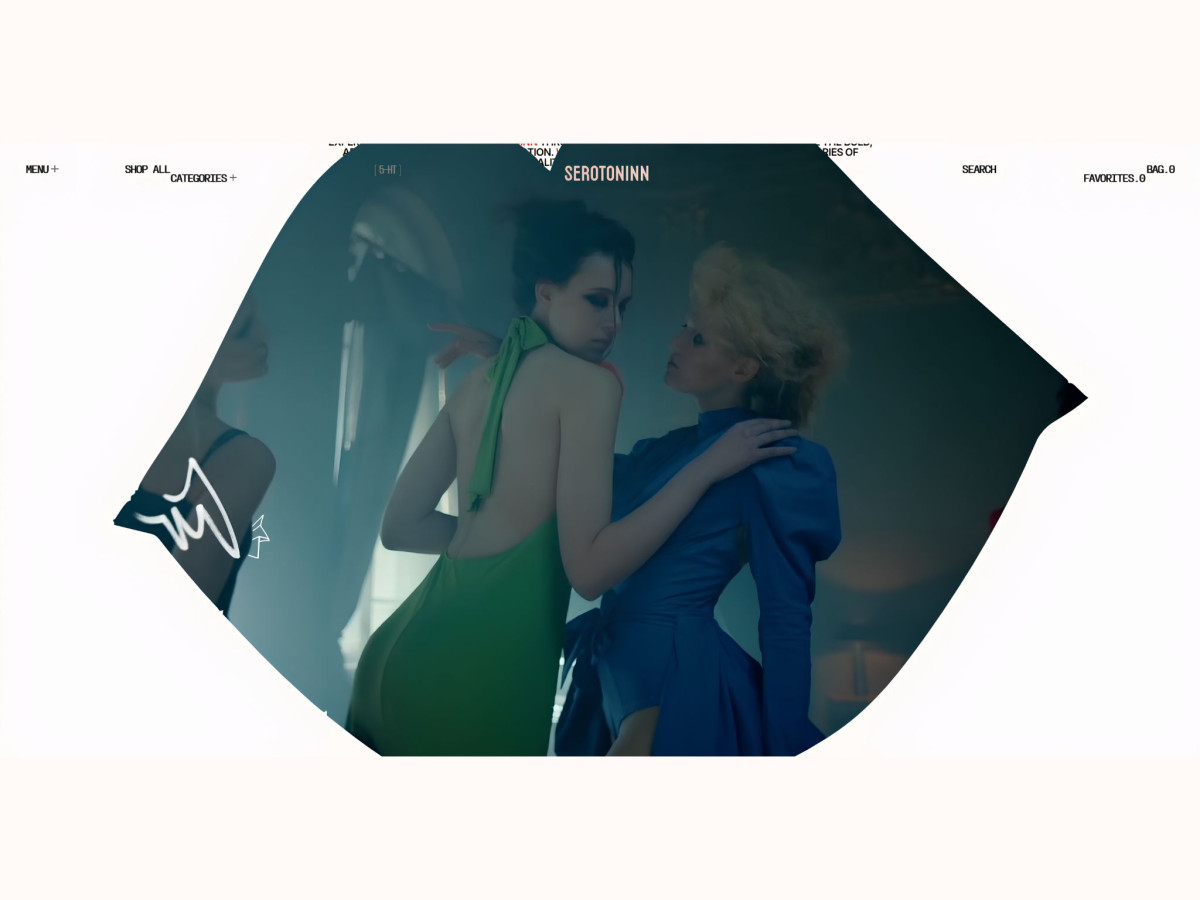 Distorted lens effect showing two models in green and blue dresses.