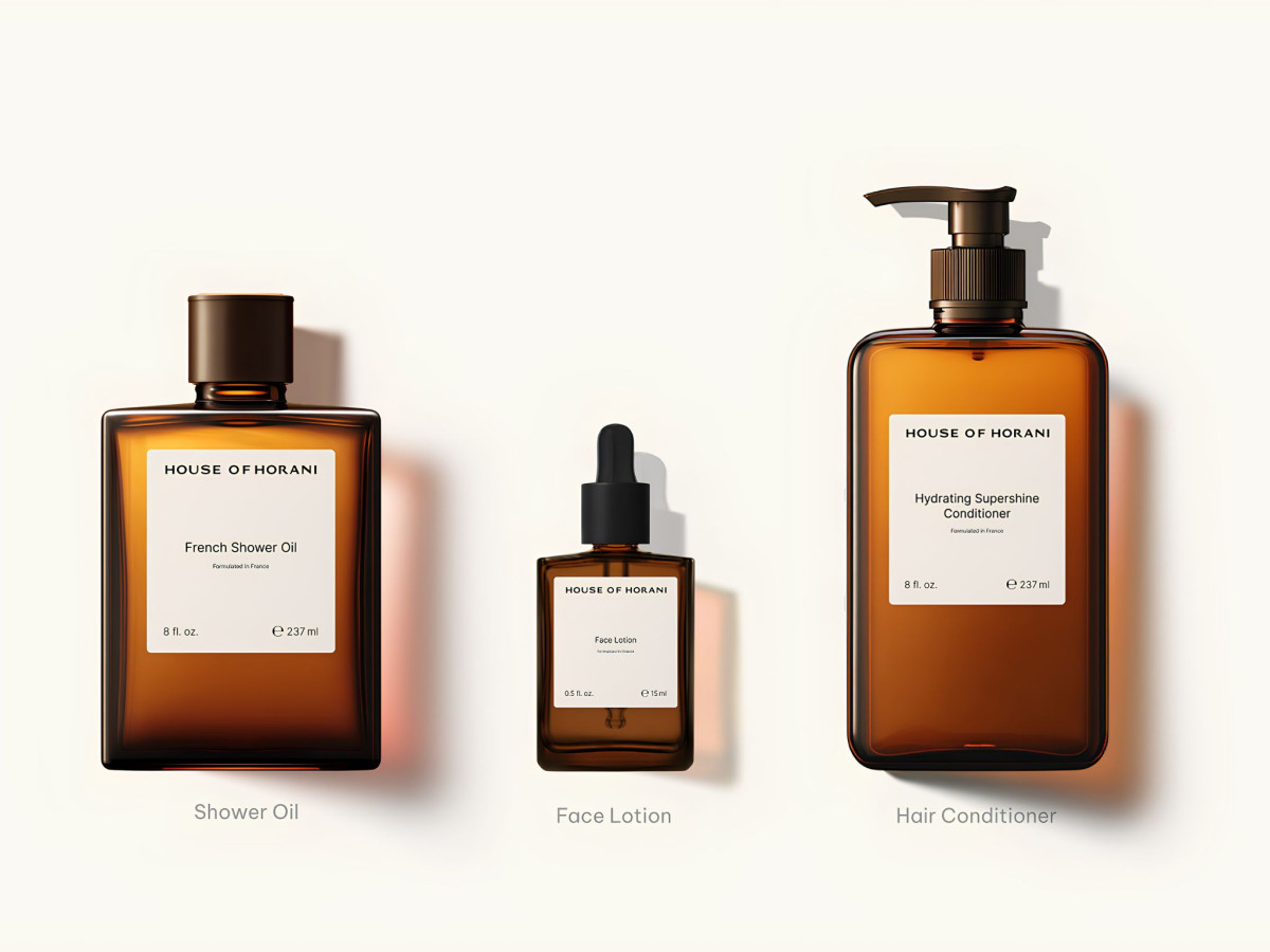 Three amber House of Horani skincare and haircare bottles.