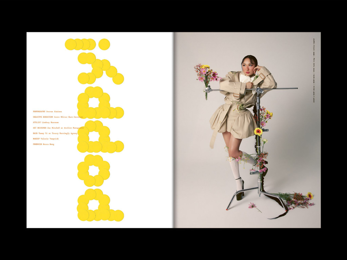 Magazine spread spelling "POPPY" in yellow dots alongside a woman posing with a flower-draped C-stand.