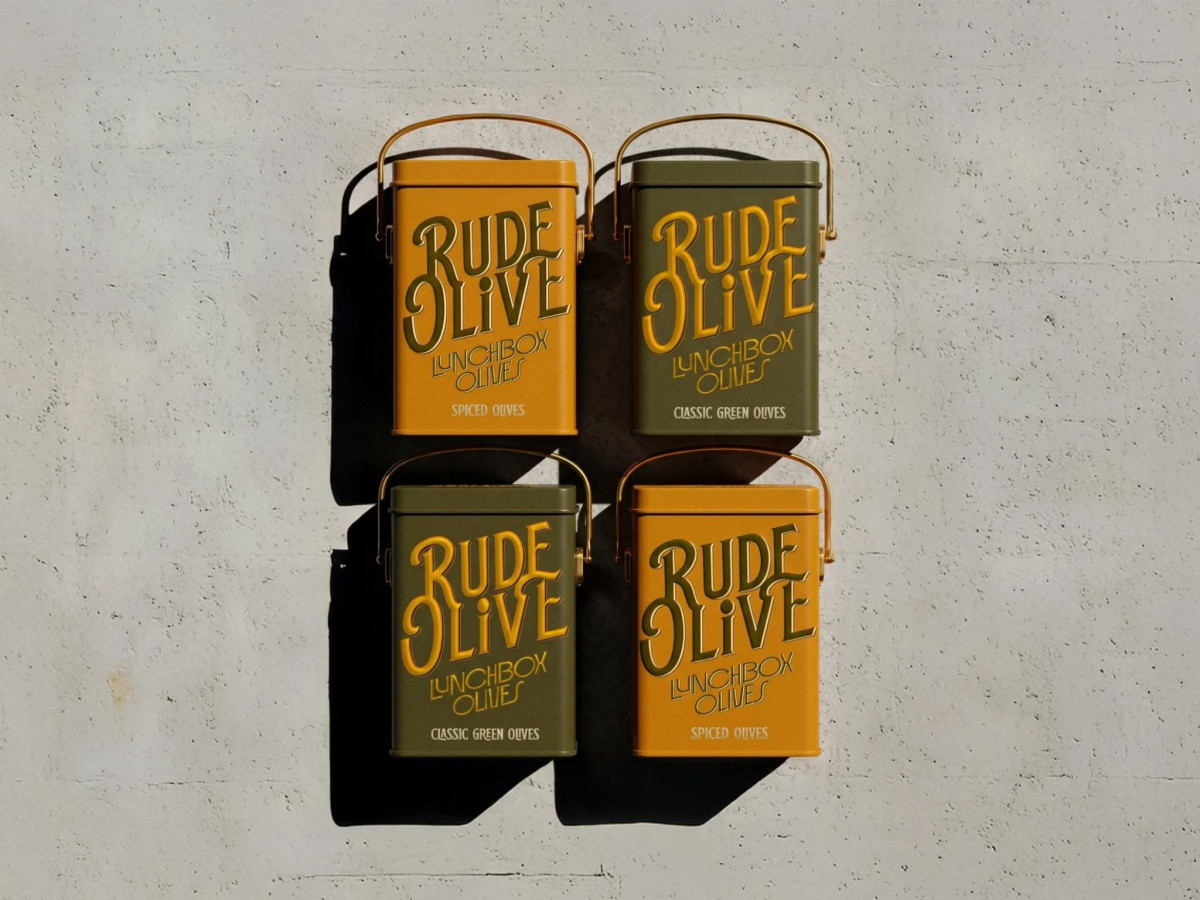 Four Rude Olive tins on a white surface.