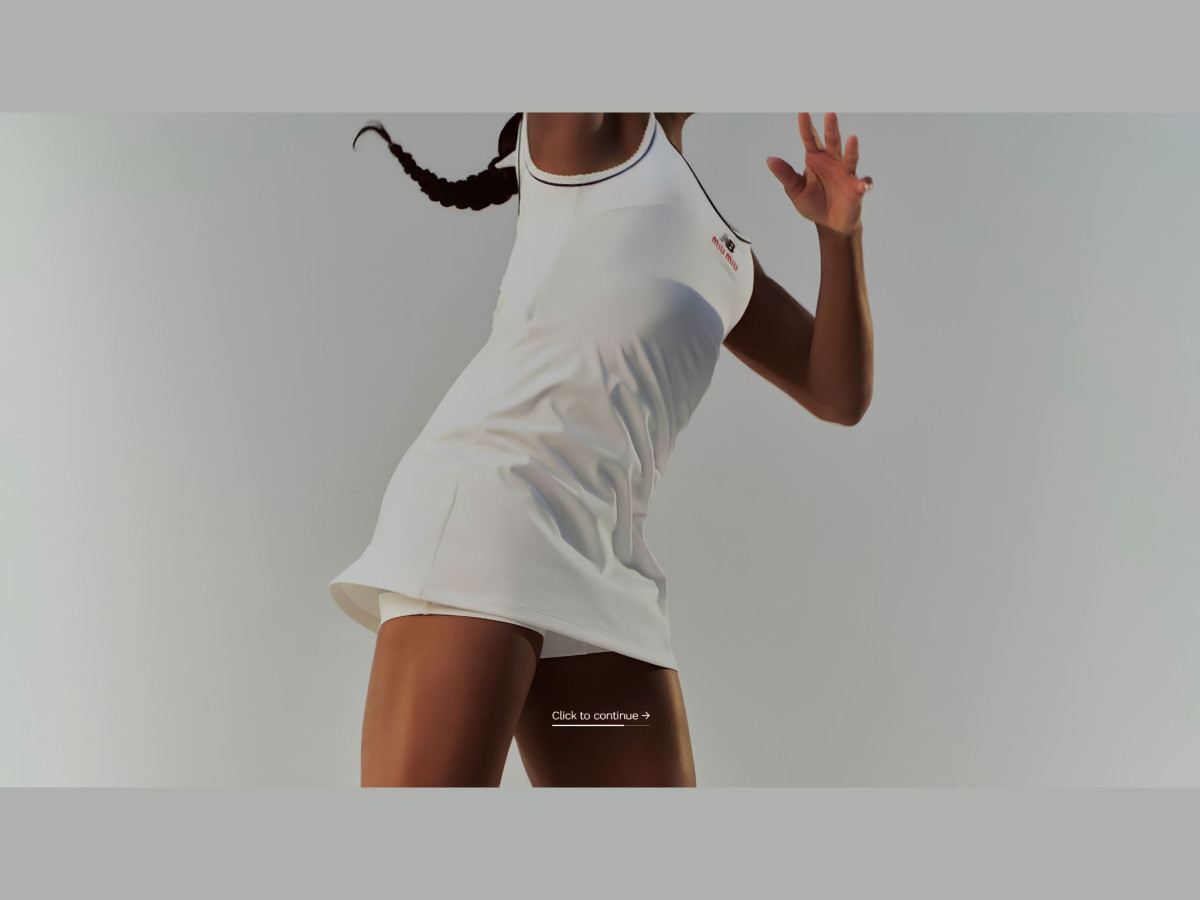 Woman in a white Miu Miu tennis dress mid-action.