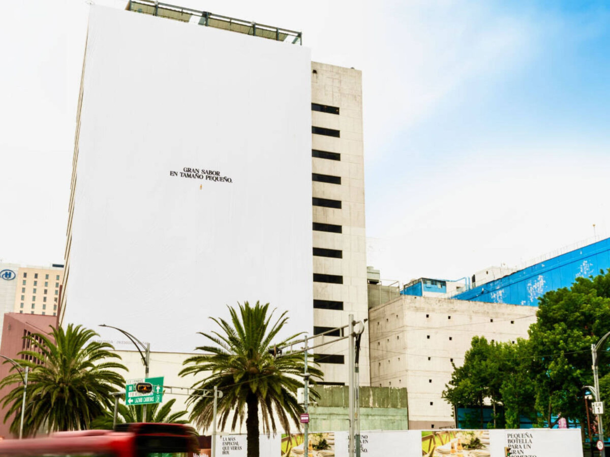 Close-up of massive white billboard with tiny text.