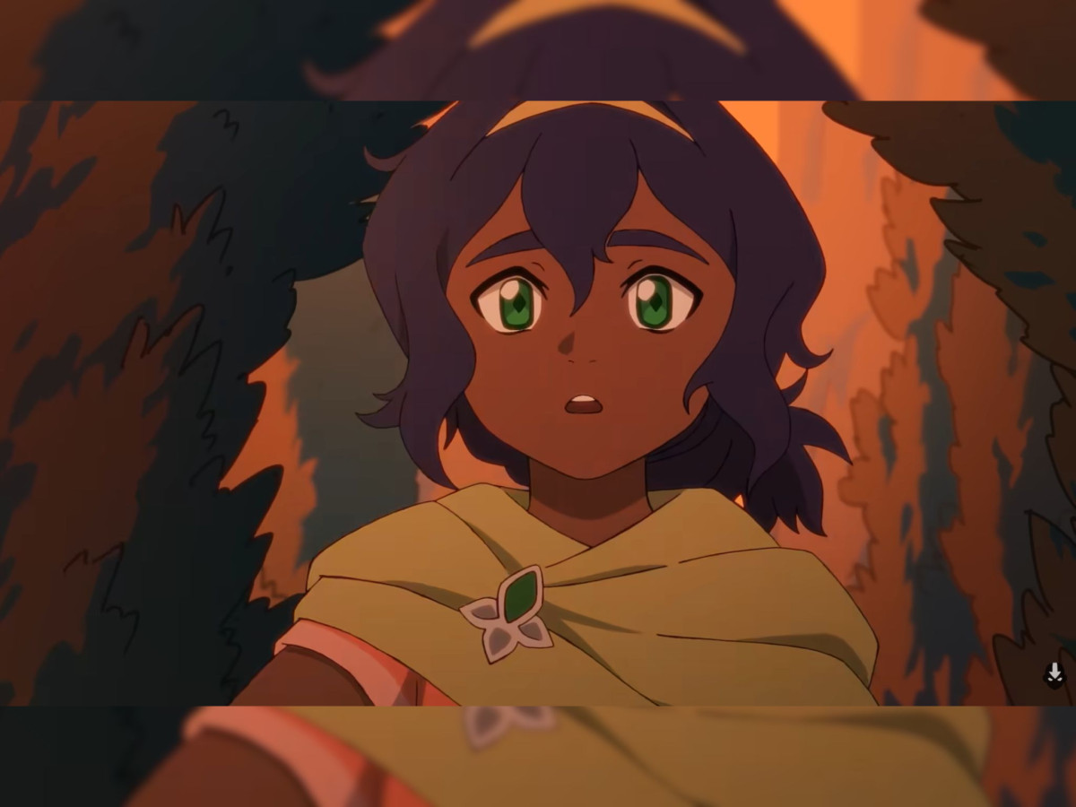 Animated dark-skinned girl with green eyes and cloak.