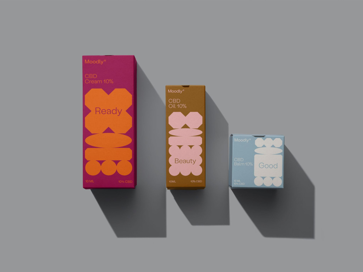 Three colorful Moodly CBD boxes featuring geometric mood shapes.