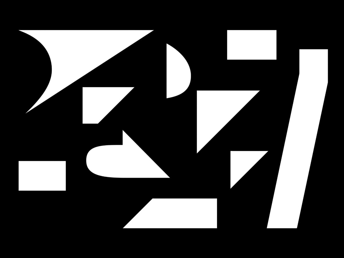 Abstract white geometric shapes on a black background.