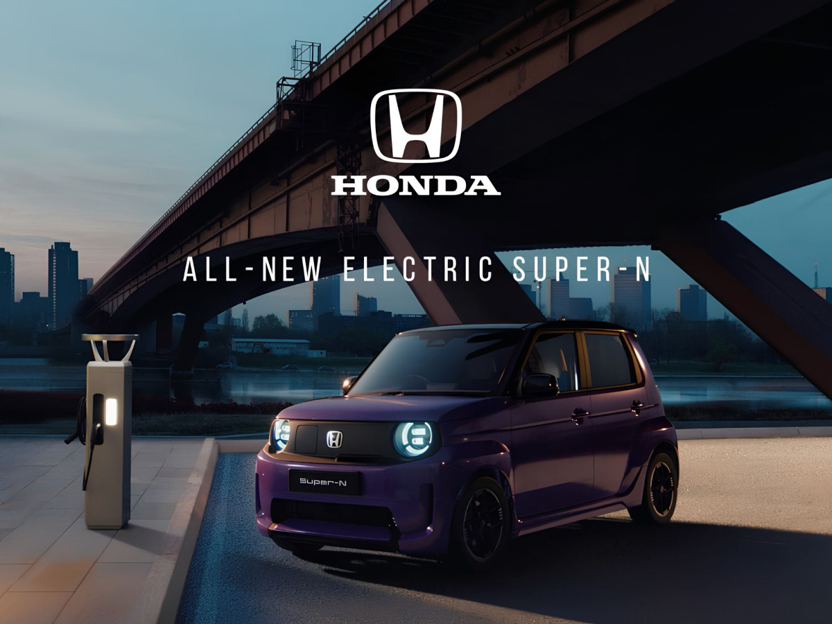 Purple Honda Super-N parked by an EV charger.