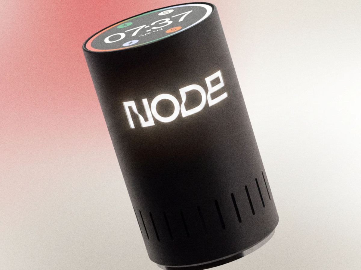 Black cylindrical Node device with illuminated logo.