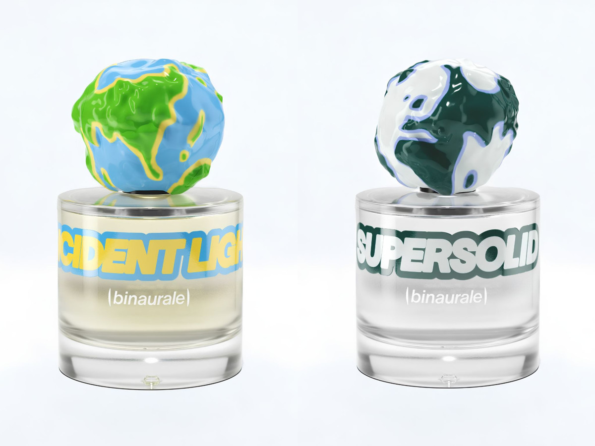 Two glass perfume bottles with textured globe-shaped caps.