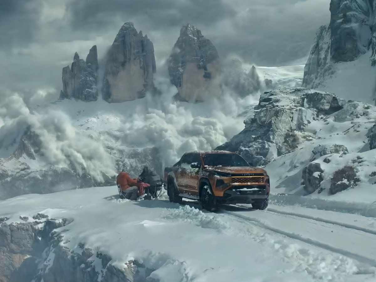 Toyota Hilux parked on a snowy mountain edge during an avalanche.