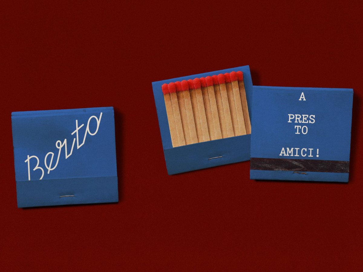 Blue Berto matchbooks with red matches on burgundy background.