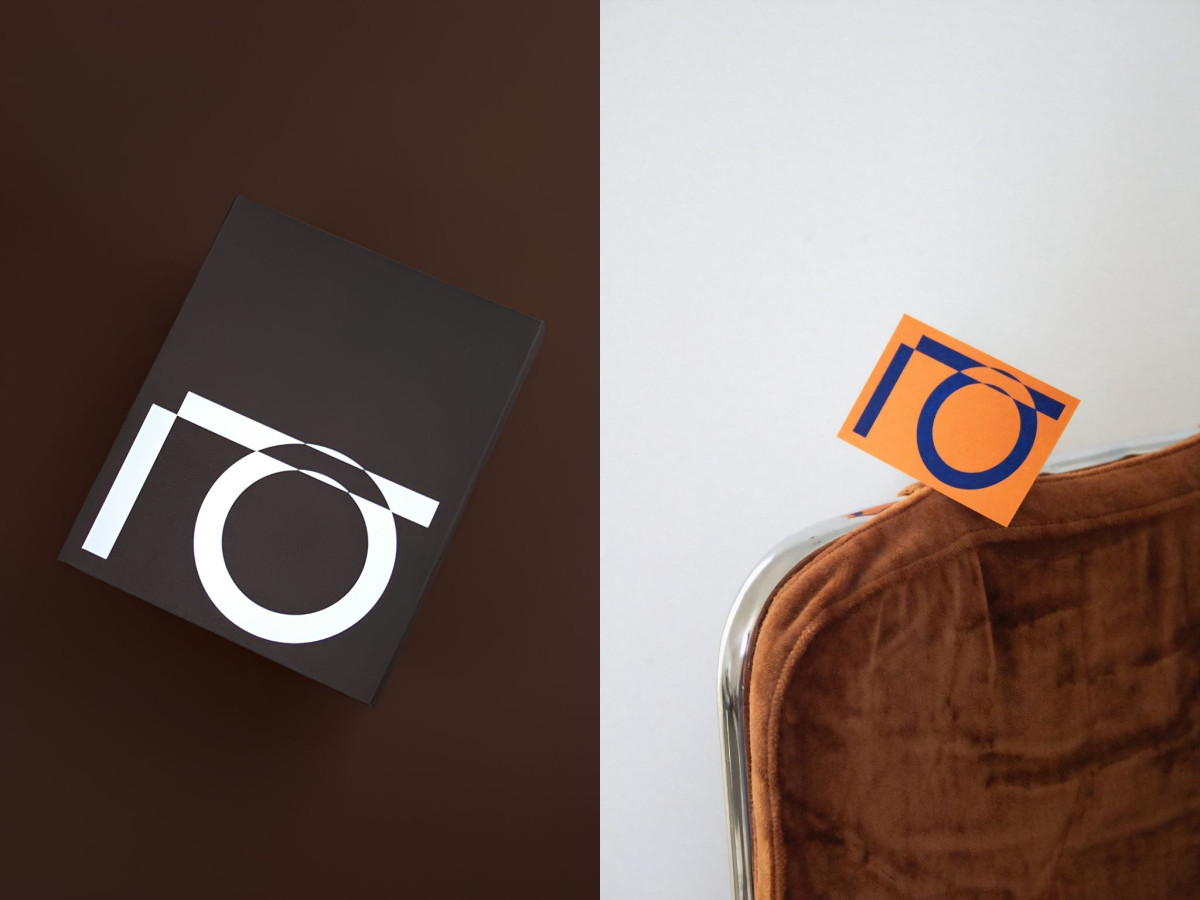 White IO logo on black box and orange IO card.
