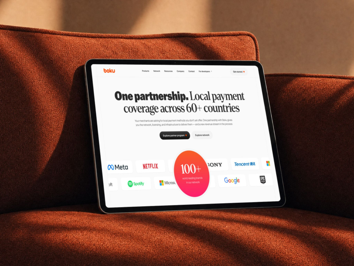 Tablet showing the Boku website's partnership page and various brand logos.