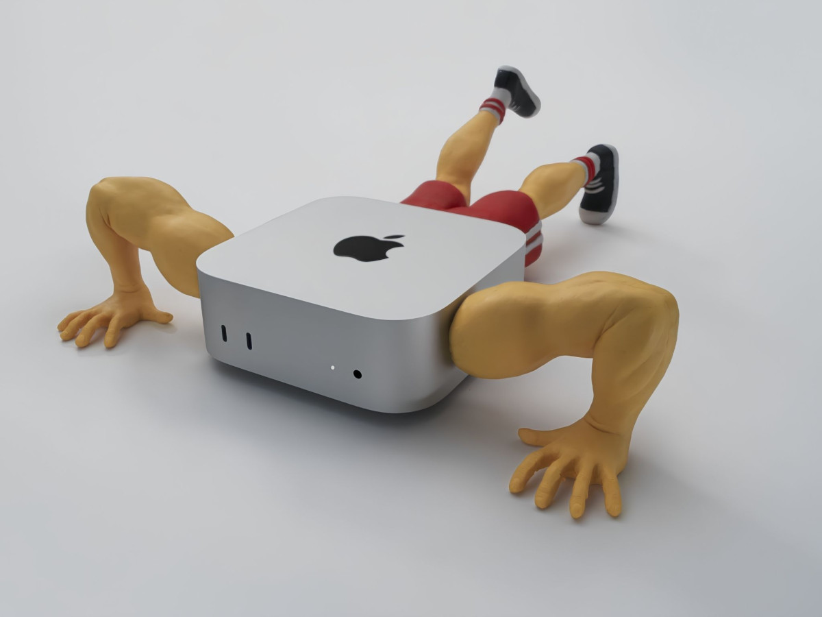Claymation Mac mini with muscular arms and legs doing push-ups.