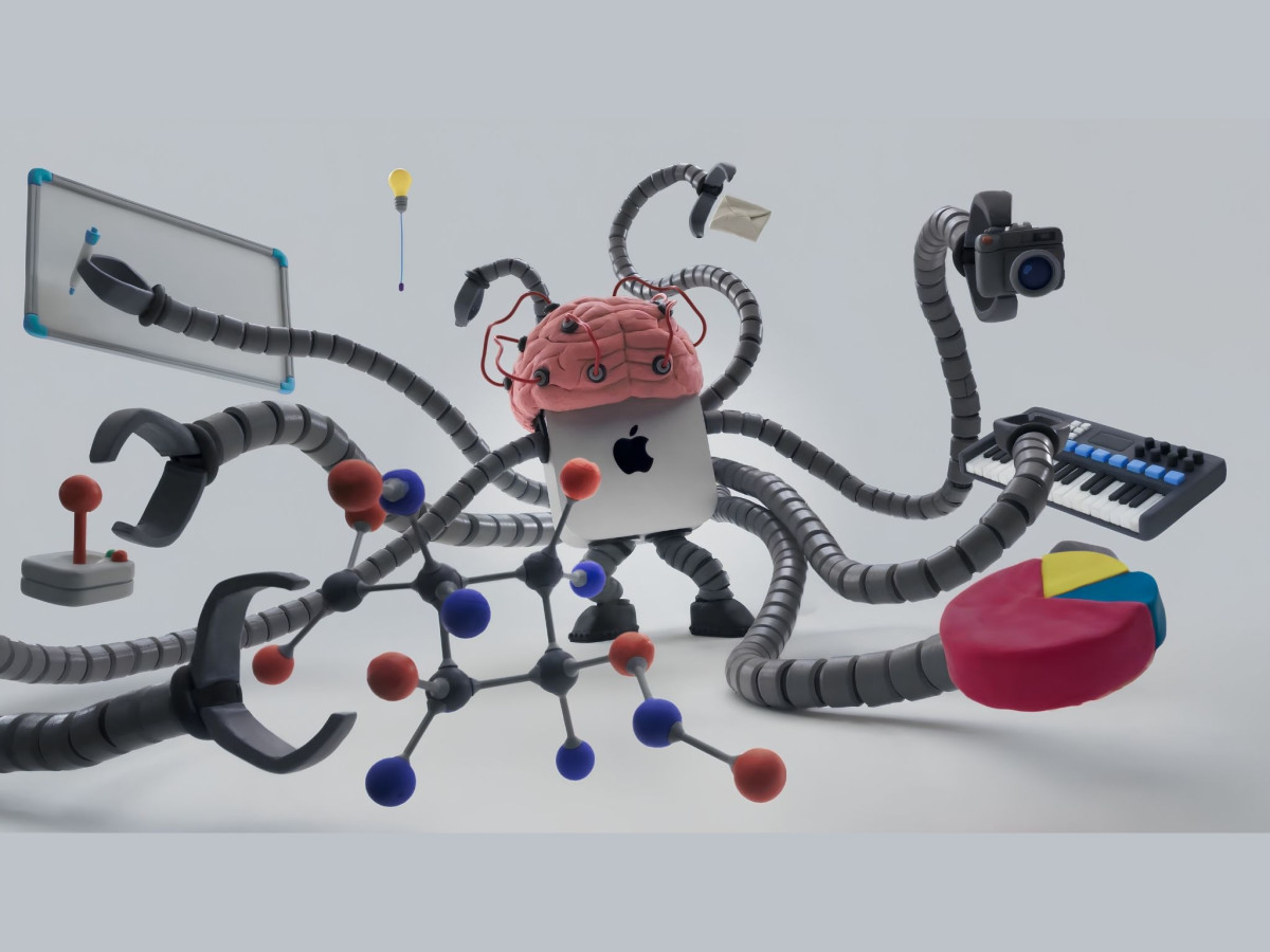 Claymation Mac mini featuring a brain on top and multiple robotic arms holding various tools.