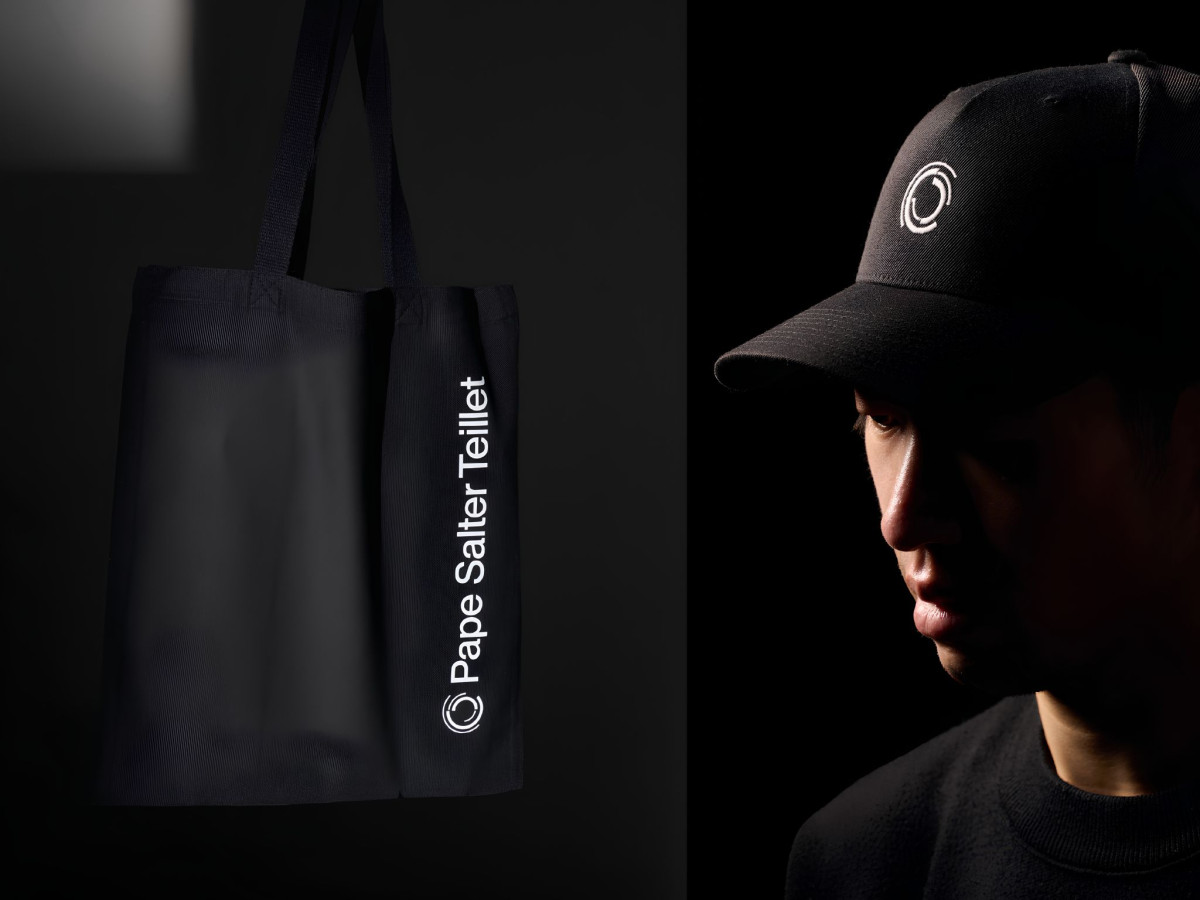 Black tote bag and cap branded with Pape Salter Teillet.
