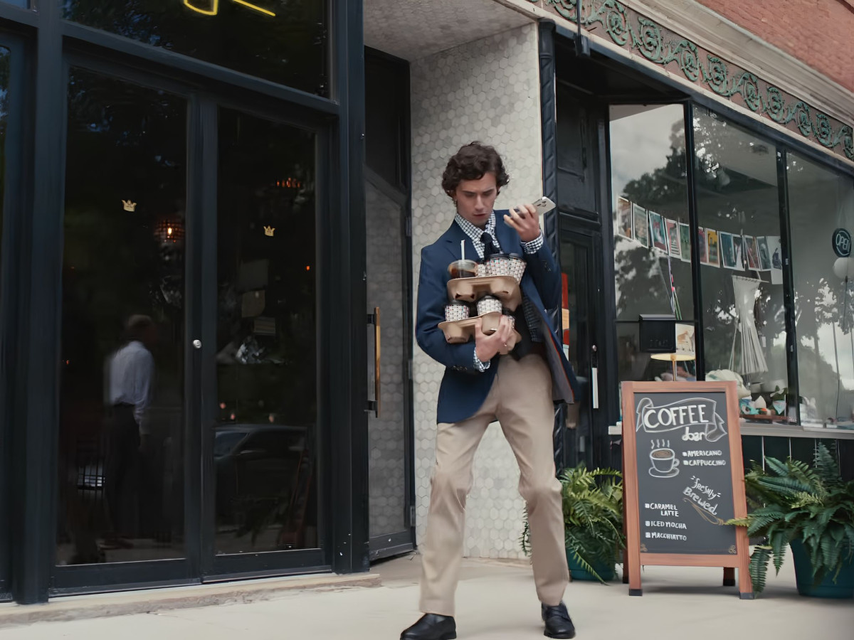 Person interacting with a chatbot interface during the Snickers Hungr.AI commercial.