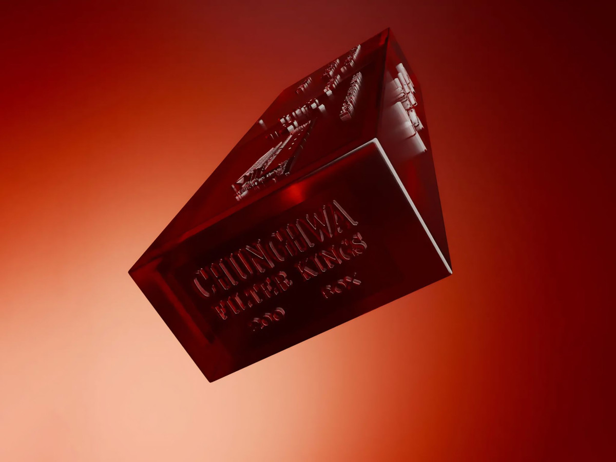 Red glass block engraved with Chunghwa Filter Kings.