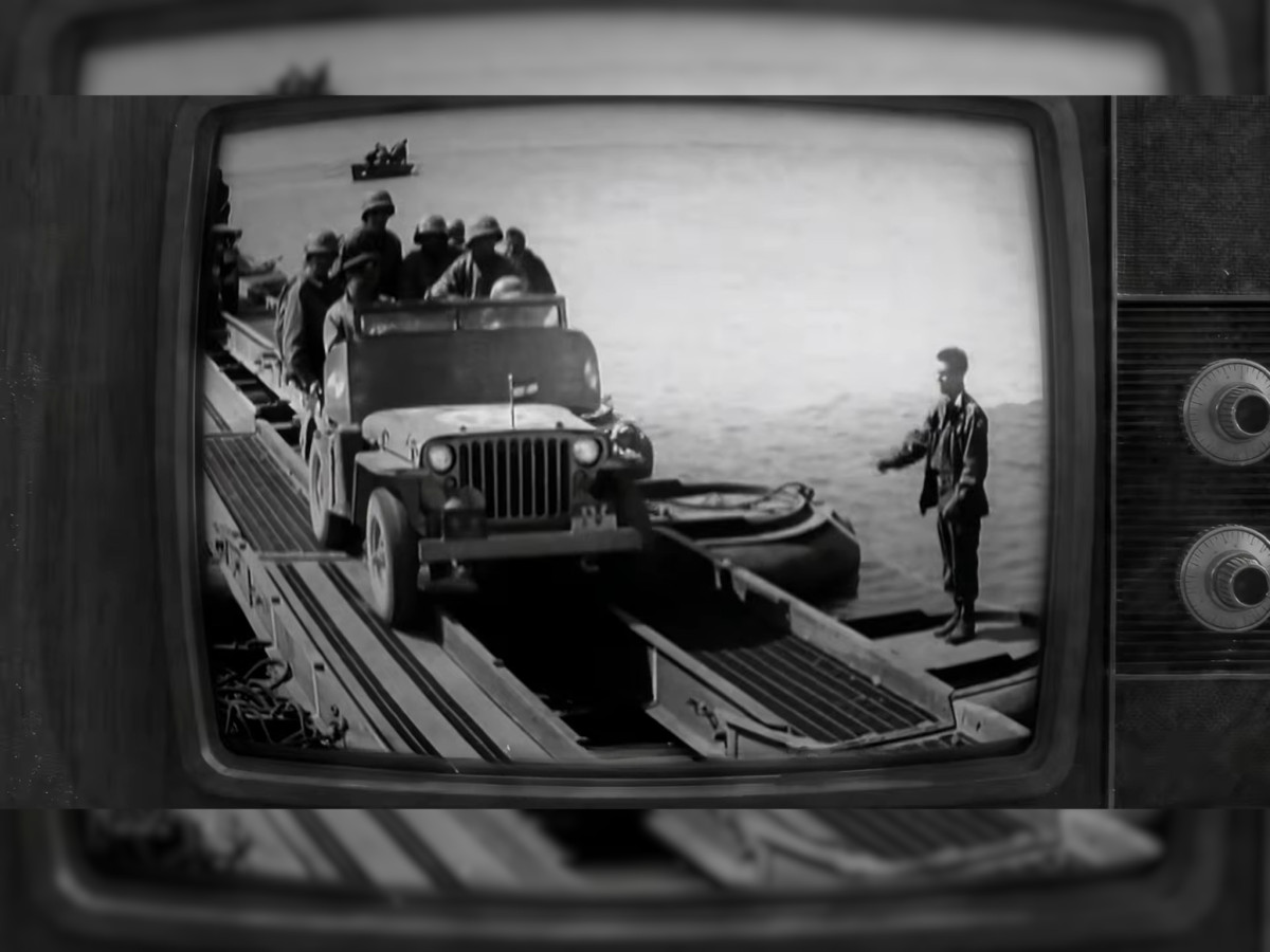 Black-and-white military Jeep on a vintage TV screen.