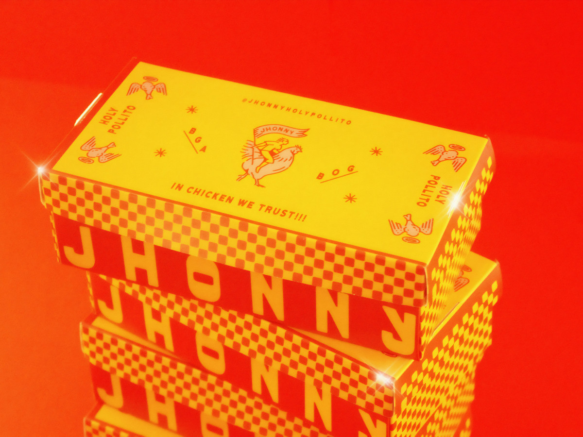 Stacked yellow Jhonny boxes with red checkerboard sides.