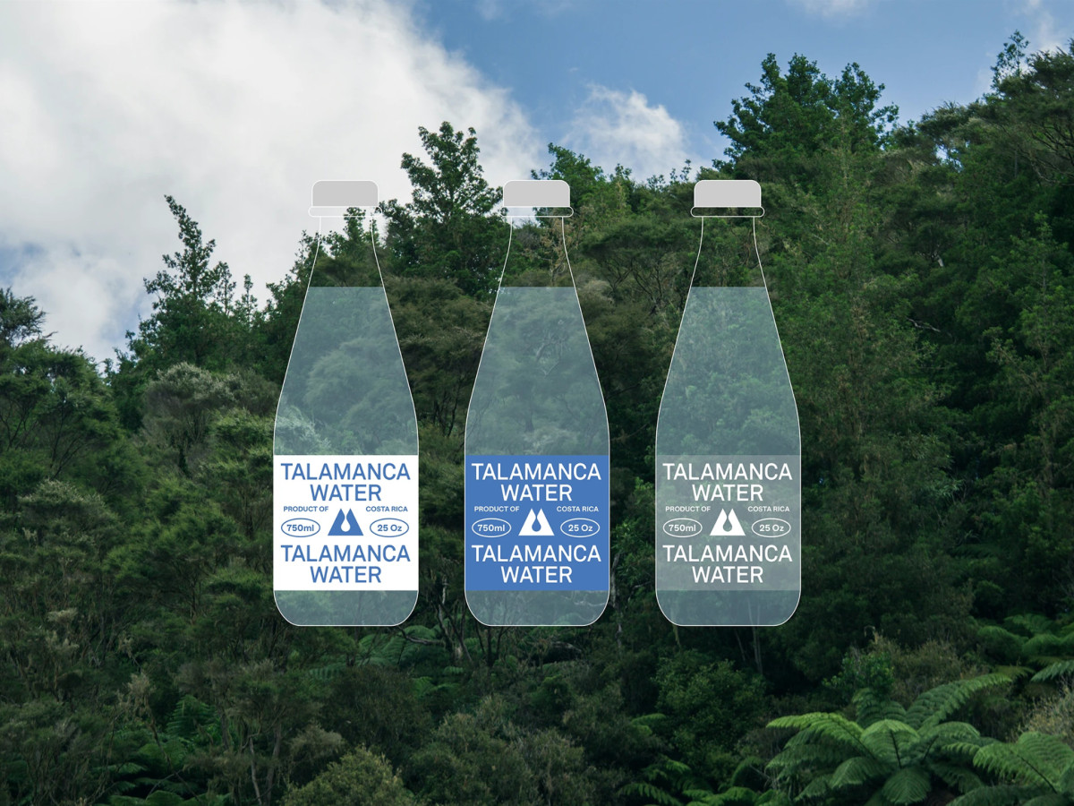 Three Talamanca Water bottles against a lush forest background.